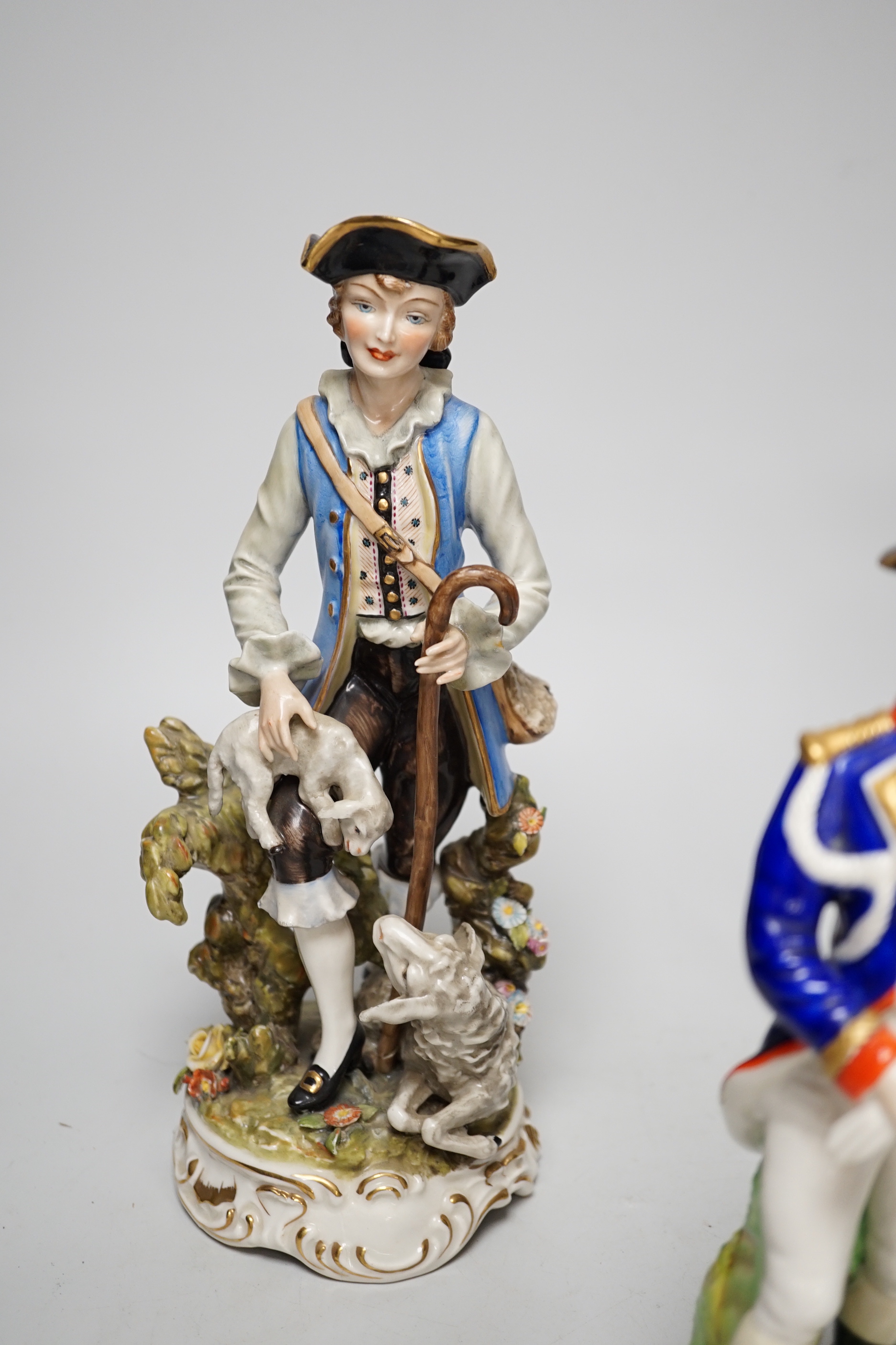 Two Dresden figure groups comprising a Shepherd and Admiral, together with one other, the largest 26cm high (3)